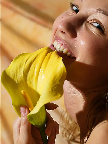 Masha P is lying on silk sheet and gently fondling her smooth bo