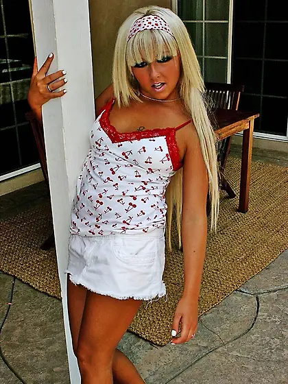 Blonde hottie Patricia Petite with pierced clit spreads her butt