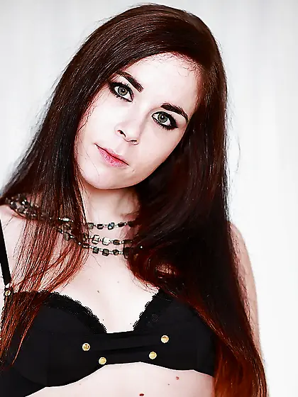 Living room is used by girl in black lingerie for spicy striptea