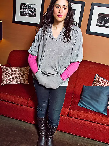 Chick in pantyhose takes bra off and poses topless with her sagg