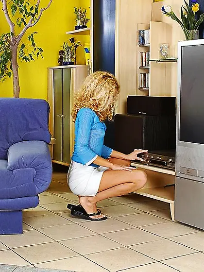 Marvelous female admires her huge dildo before undressing,  cares