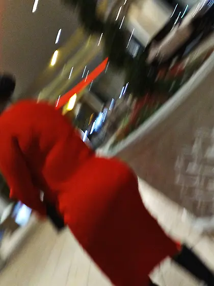 Red dress juicy GILF with phat ass at the casino.