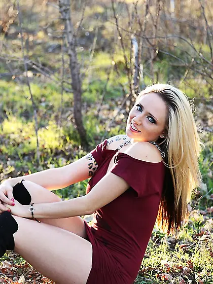 Gorgeous hot blonde Lily Xo shows her posing skills as she tease