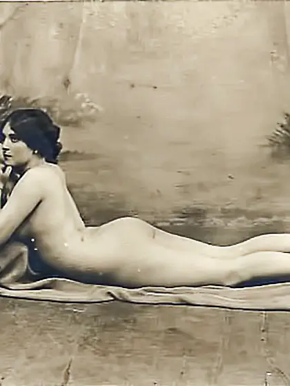 Flashes smile poses seductively