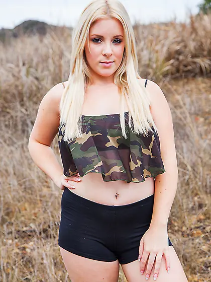 Attractive chubby angel poses all naked on the swings on a warm