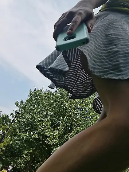 Upskirt of a braless hot milf