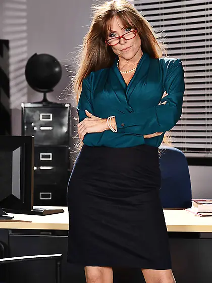 Redhead with a pale body sucking cock and fucking at the office