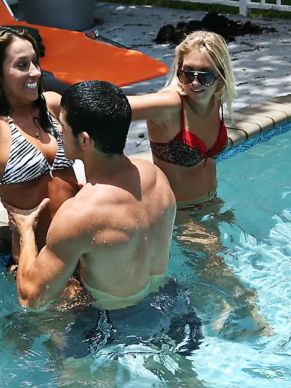 Bikini-clad babes fucking a big-dicked dude next to the swimming