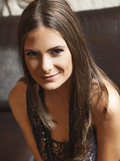 Black-haired babe lies leather