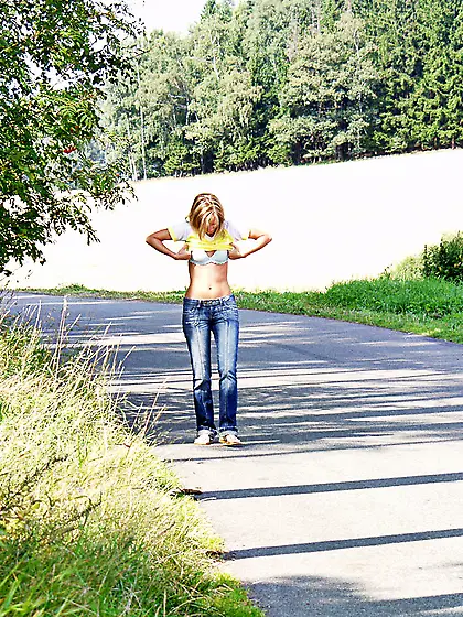 Sylvie Sinner takes her tight blue jeans off on the field and sh