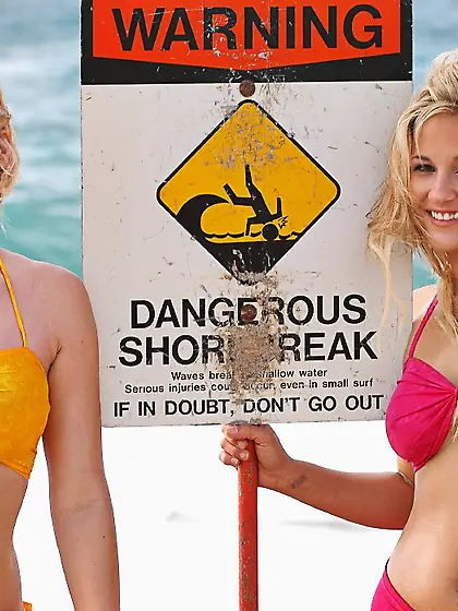 Cute babe Alison Angel posing at the beach with her friend and s