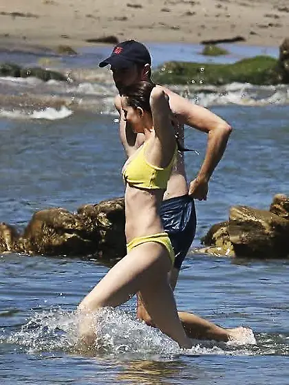 Dakota Johnson in a yellow bikini
