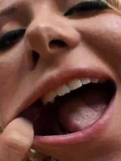 Blonde girl mouth stretched