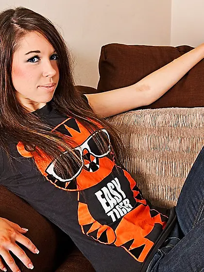 Oversized t-shirt brunette teen masturbating on a big brown couc