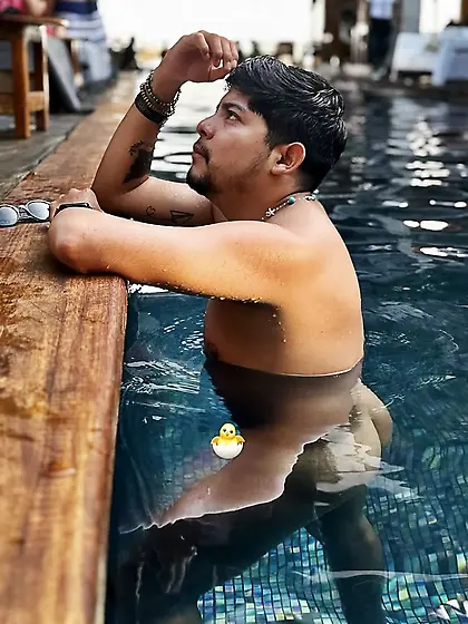 Man skinny dipping at the beach/pool