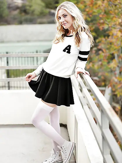 Blonde cutie poses naked outdoors just wearing white stockings a