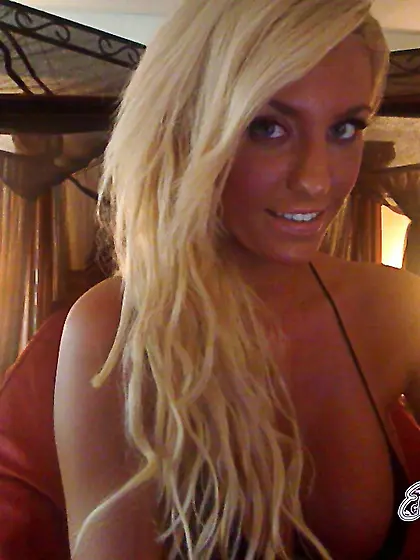 Classy busty blonde Ember Reigns strips her clothes and shows he