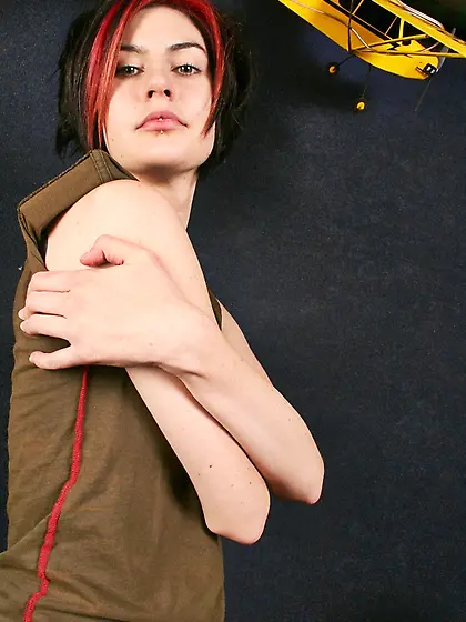 Winning beauty smokes cigarette before undressing to pose fully