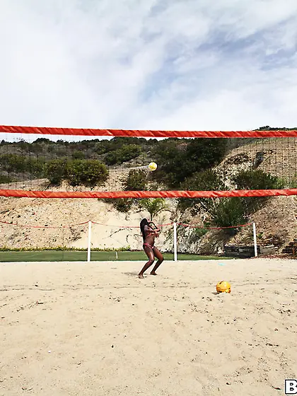 Sexy ebony slut after a friendly game of volleyball gets indoors