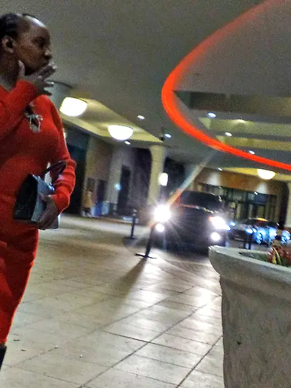 Red dress juicy GILF with phat ass at the casino.