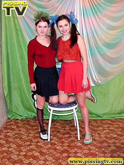 Two cute girls pissing