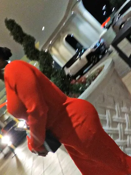 Red dress juicy GILF with phat ass at the casino.