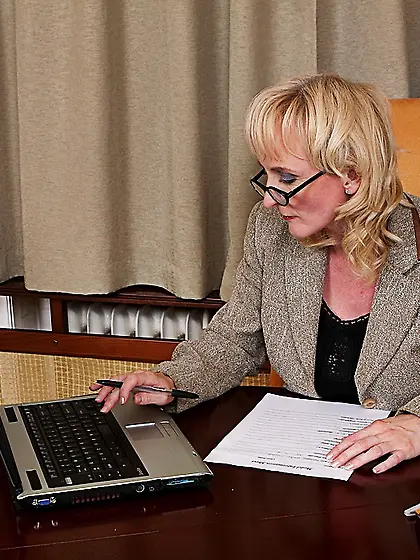 Busty woman Monika Wipper takes off her office suit and underwea