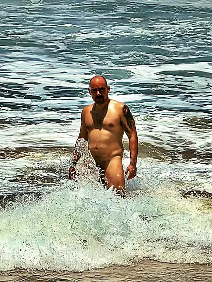 Man skinny dipping at the beach/pool