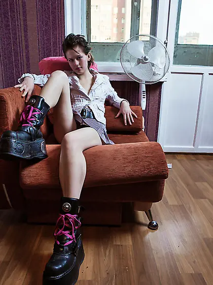 Rebellious cutie with small tits provocatively undresses in the