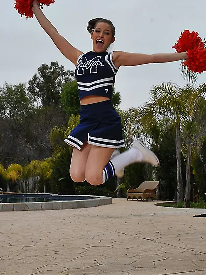 Dani Daniels takes her slutty skirt off on the sofa and shows us