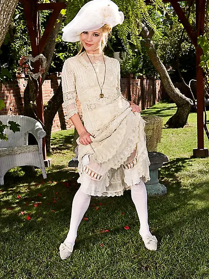 Proper lady Aurora Snow slowly strips off her sweet white gown t