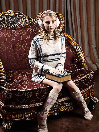 Girl with headphones on takes warm sweater off to expose pussy o