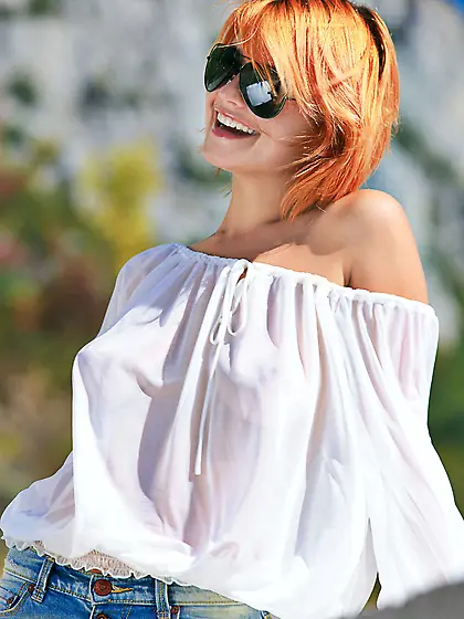 Denim-loving redhead decides to get naked by the side of the roa