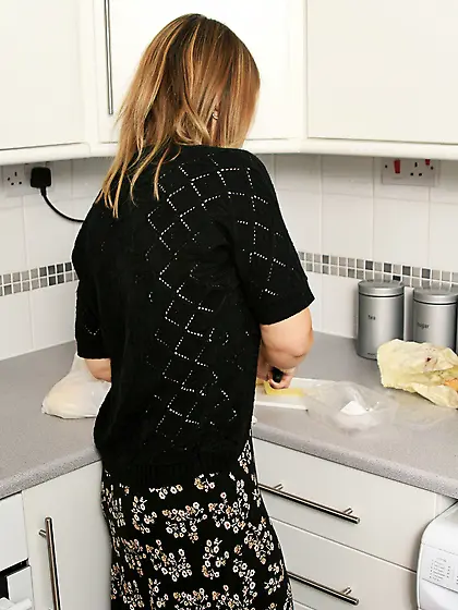 Big breasted mature lady Sandy Jones in black nylons shows her n