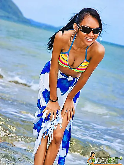 Ladyboy in bikini visits beautiful Thai beach