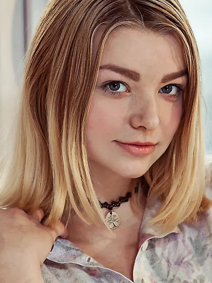 Blond-haired teen in a choker showing off her natural big breast