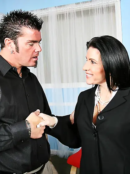 Busty brunette milf Kendra Secrets takes off her black smart sui