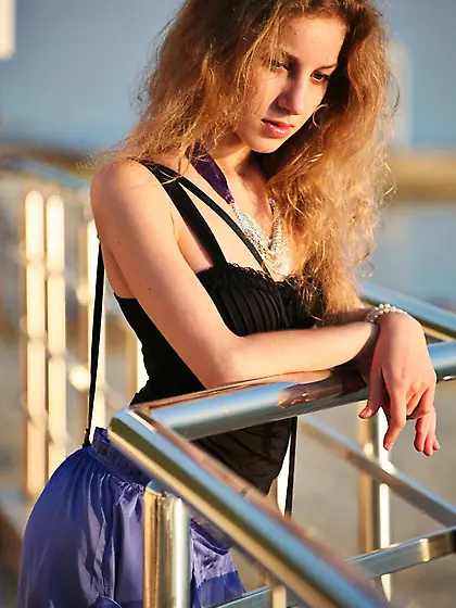 The seducing chick Erika F is posing outdoor slowly losing the c