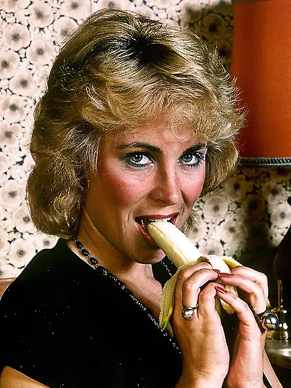 Indulging milf sits orange