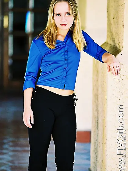 Cute miss Lillian Lee unbuttons her blue blouse and displays her