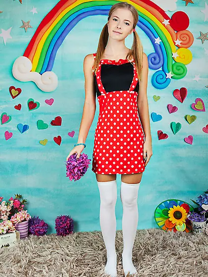 Young woman in a polka-got red dress gets nude in her infantile