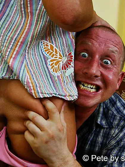 Young girl rides on old grandpa