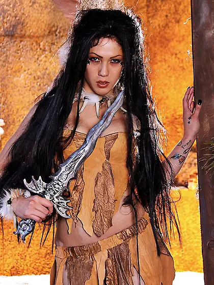 Wild woman Asphyxia Noir with long raven hair shows off her priv