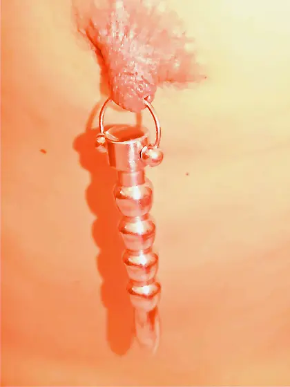 Pierced Nipples Stretched with Weights.