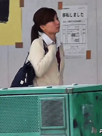 Japanese coed babe crouches