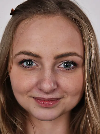 Young woman understands she can't hide from camera and has to po