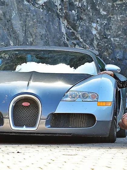 Beauty with big boobs riding a rather large toy for the camera