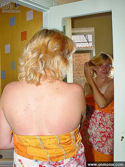 Mature blonde fucked in bathroom