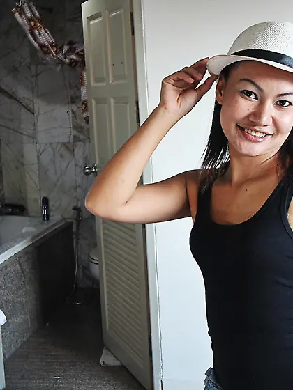 Flat-chested Asian girl uncovers hairy pussy and gets nailed by