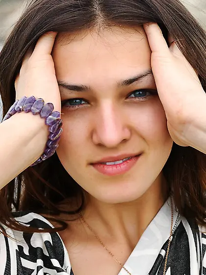 The busty bimbo Sofi A is posing on the sea shore covered with n